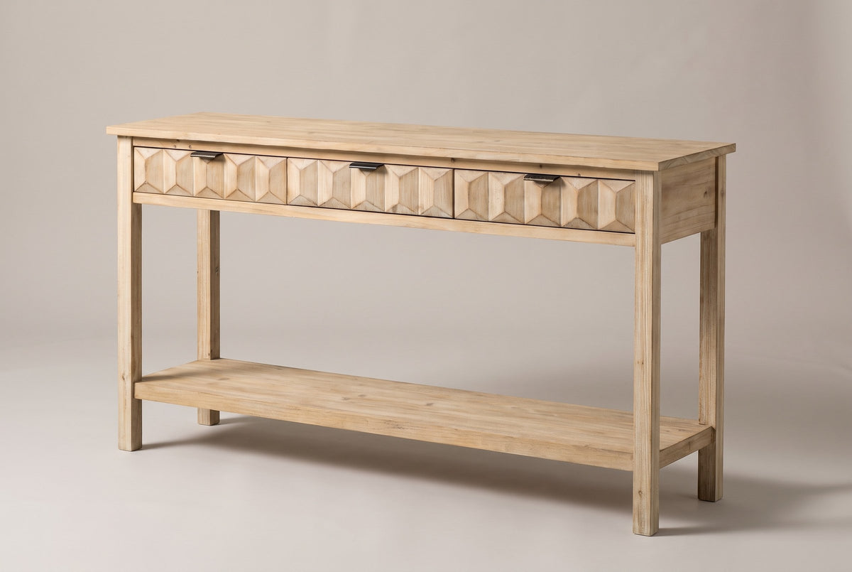 Velletri 3-drawer console table in natural fir, three-quarter view on a warm grey studio backdrop