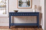 Navy blue Velletri console table in the pine-panelled entry of a Muskoka lake cottage