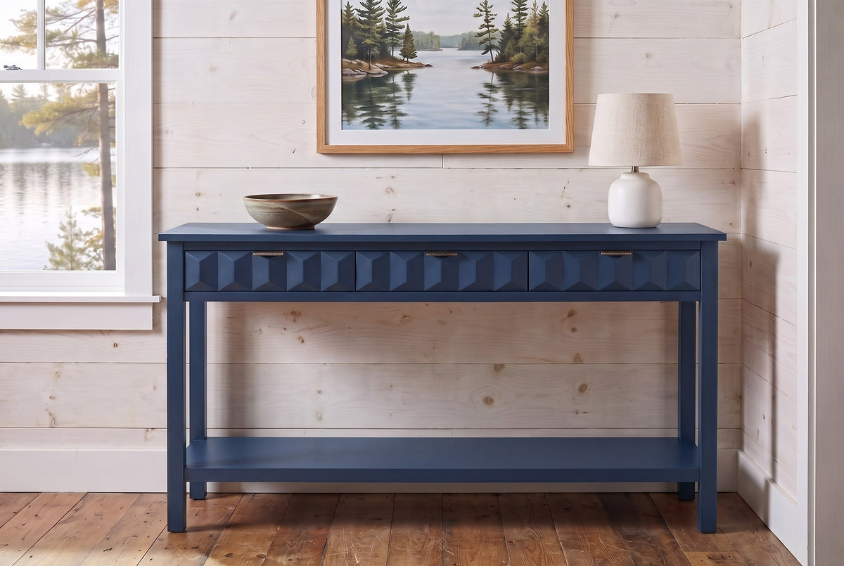 Navy blue Velletri console table in the pine-panelled entry of a Muskoka lake cottage