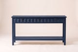 Velletri console table in navy blue, straight front view: three honeycomb drawers with iron pulls