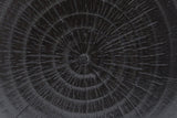 Close-up of the Black Venzone top: moulded rings and fine radial checks in the cast surface