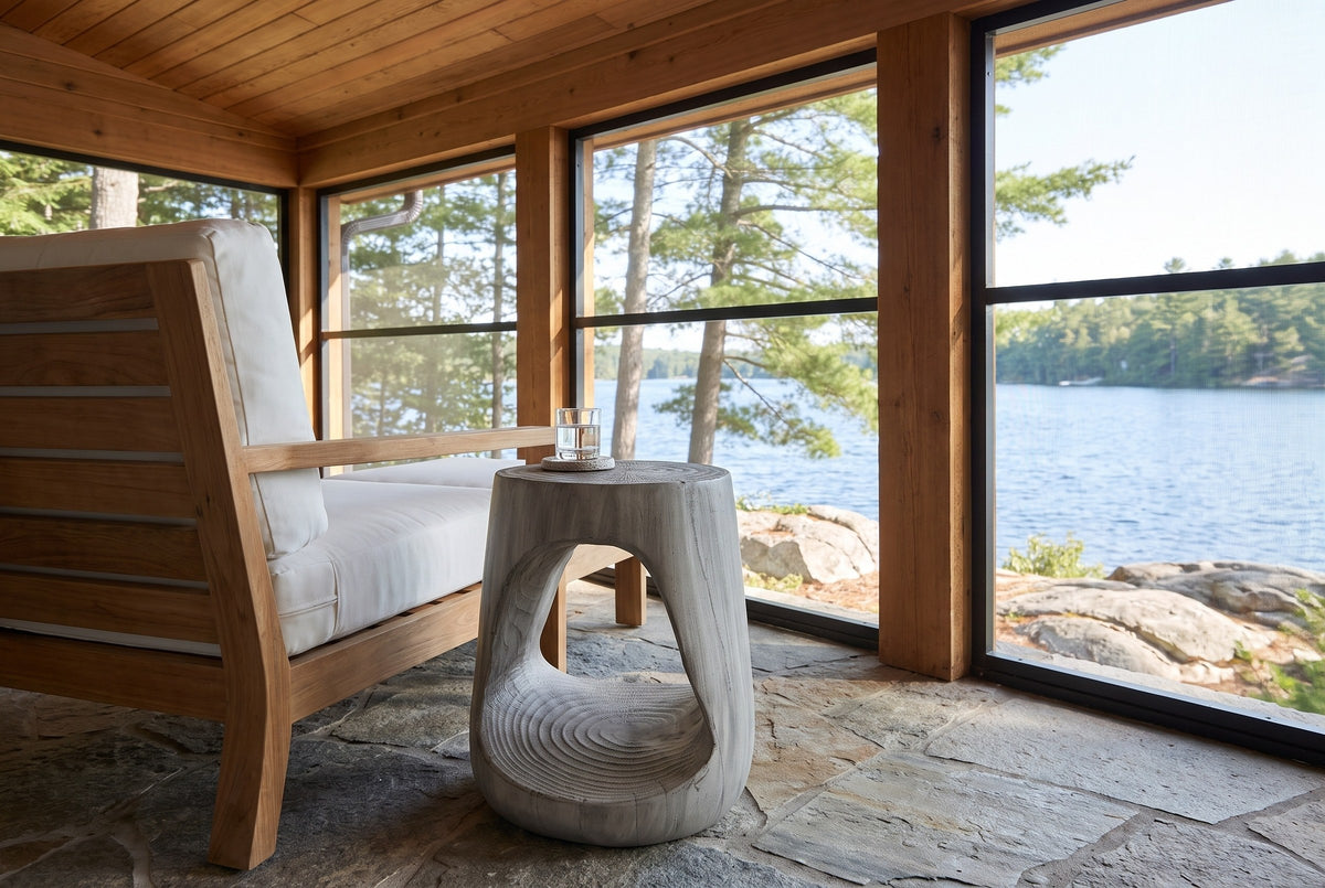 Venzone side table beside a teak lounge chair on a screened Muskoka cottage porch above the lake