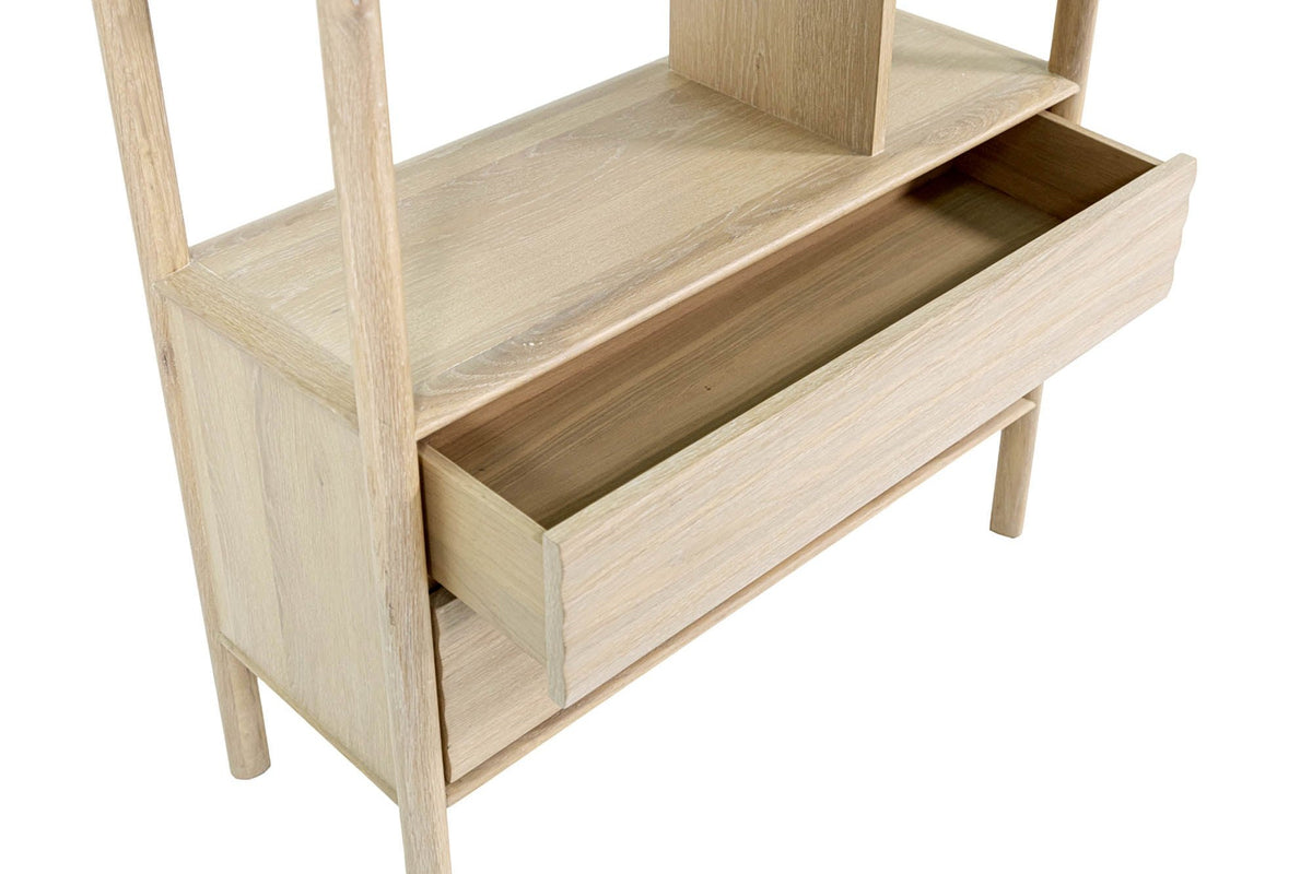 Open Vesper drawer below the lowest shelf in light oak