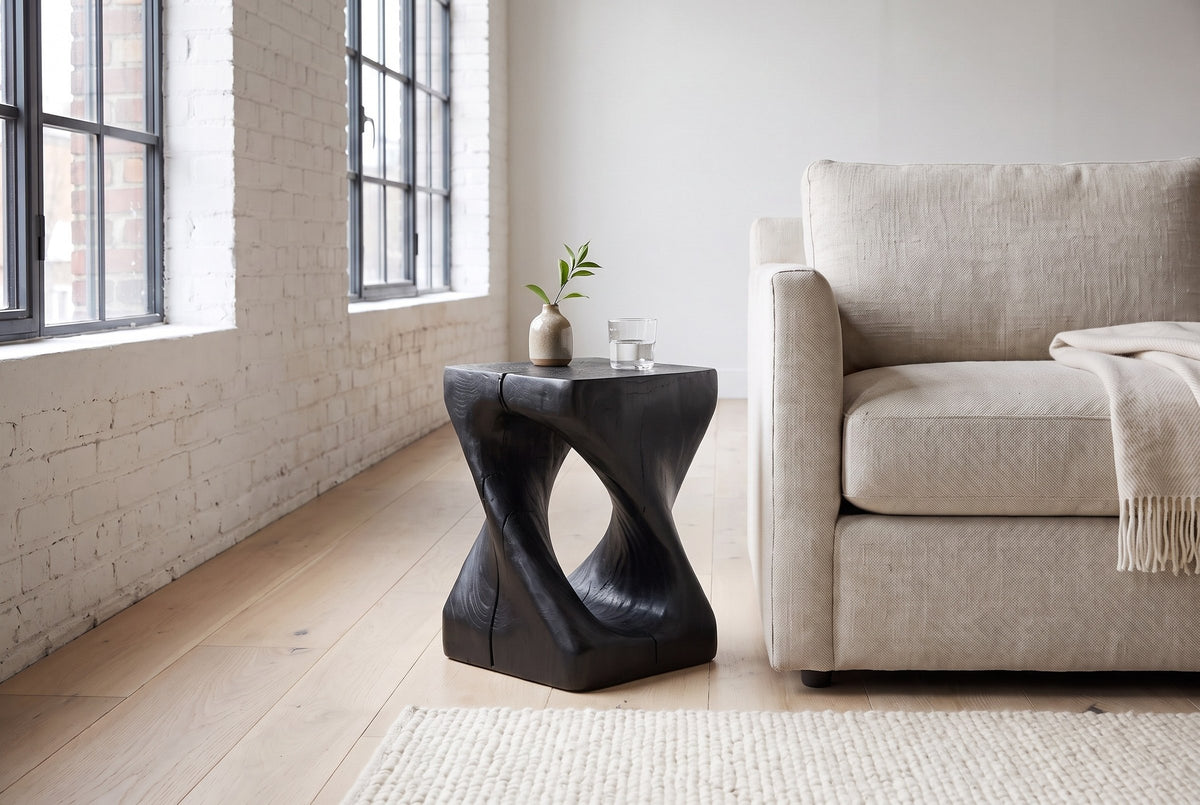 Vicenza side table in Black beside an oatmeal linen sofa in a white-brick Montreal loft