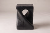 Vicenza side table in Black, straight front view: a teardrop opening and one band running corner to corner