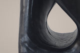 Close-up of the Black twist: the band curving round the opening, tree rings cast inside it