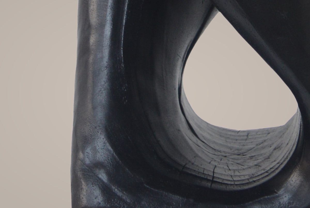 Close-up of the Black twist: the band curving round the opening, tree rings cast inside it