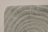 Close-up of the Grey top corner: cast tree rings and fine radial cracks in soft driftwood grey, the rounded edge