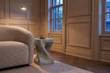 Vicenza side table in Grey beside a boucle armchair in a panelled Toronto front room at dusk, a cup and saucer on top