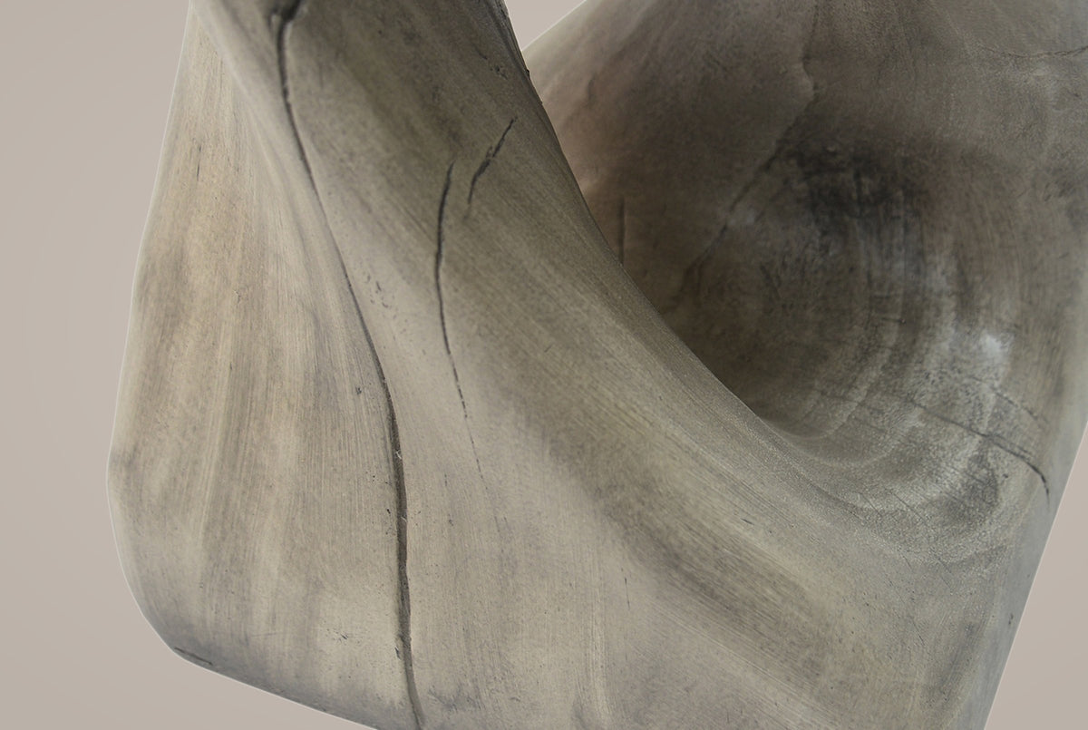 Close-up of the Grey twist where it meets the base: smooth grain streaks and thin cast crack lines along the band