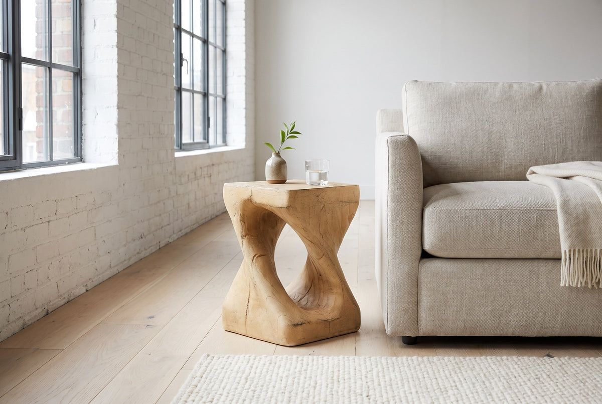 Vicenza side table in Natural beside an oatmeal linen sofa in a white-brick Montreal loft