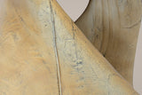 Close-up of the twist: carved facets, grain lines and a thin cast crack line running along the band