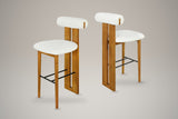 A set of two Vigoleno bar stools in White with walnut-finish frames, three-quarter view on a studio backdrop
