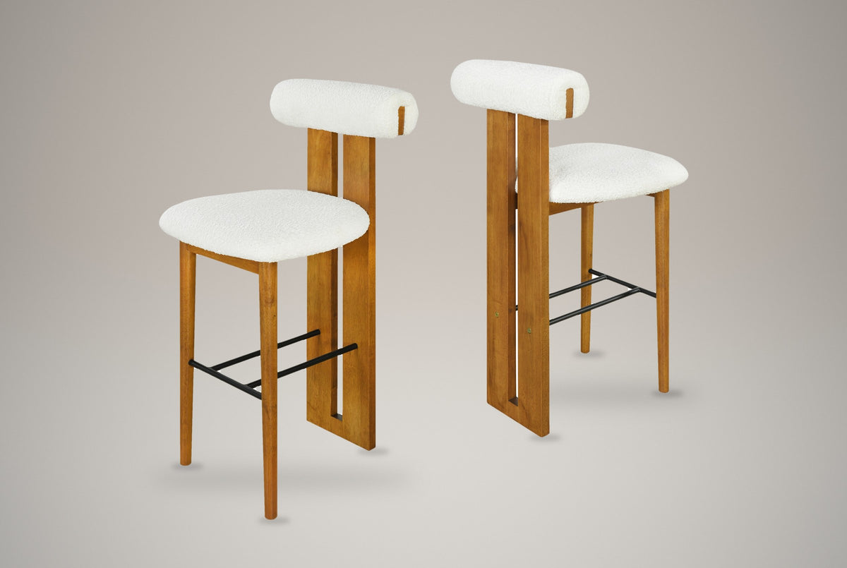 A set of two Vigoleno bar stools in White with walnut-finish frames, three-quarter view on a studio backdrop
