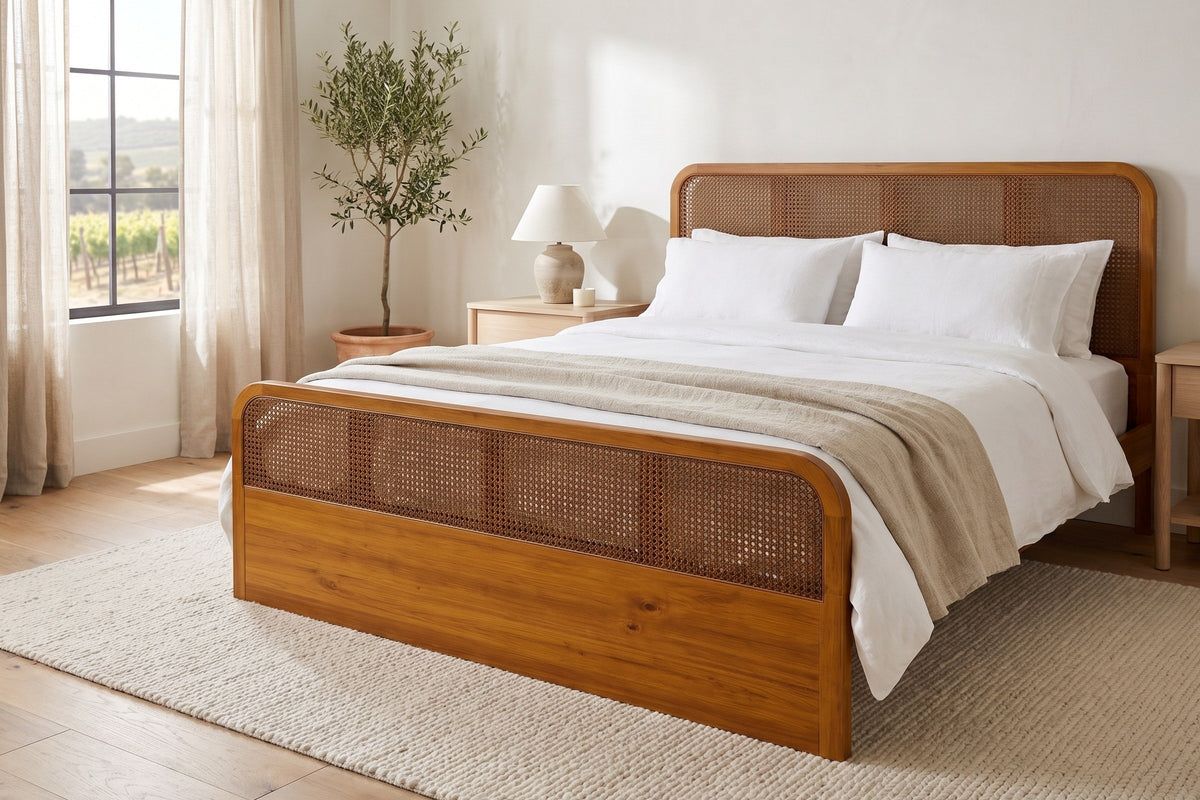 Vinci bed made up with white linen in a bright bedroom with an olive tree