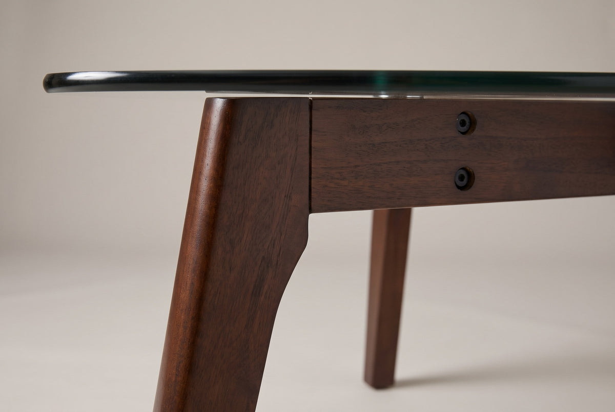 Close-up of a leg top: the curved haunch, the joint line and two bolt heads on the rail