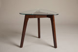 Vipiteno side table, front view: rounded-triangle glass top, three splayed walnut-stained legs