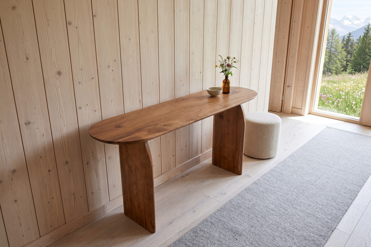 Visso console table in Pecan seen from above against a pale larch board wall in a Megeve chalet, with a whitewashed oak floor