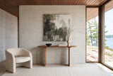 Visso console table in Pecan seen straight on against a board-formed concrete wall in a Parry Sound granite house
