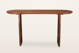 Visso console table in Pecan from the long side, on a warm white studio backdrop: the long top