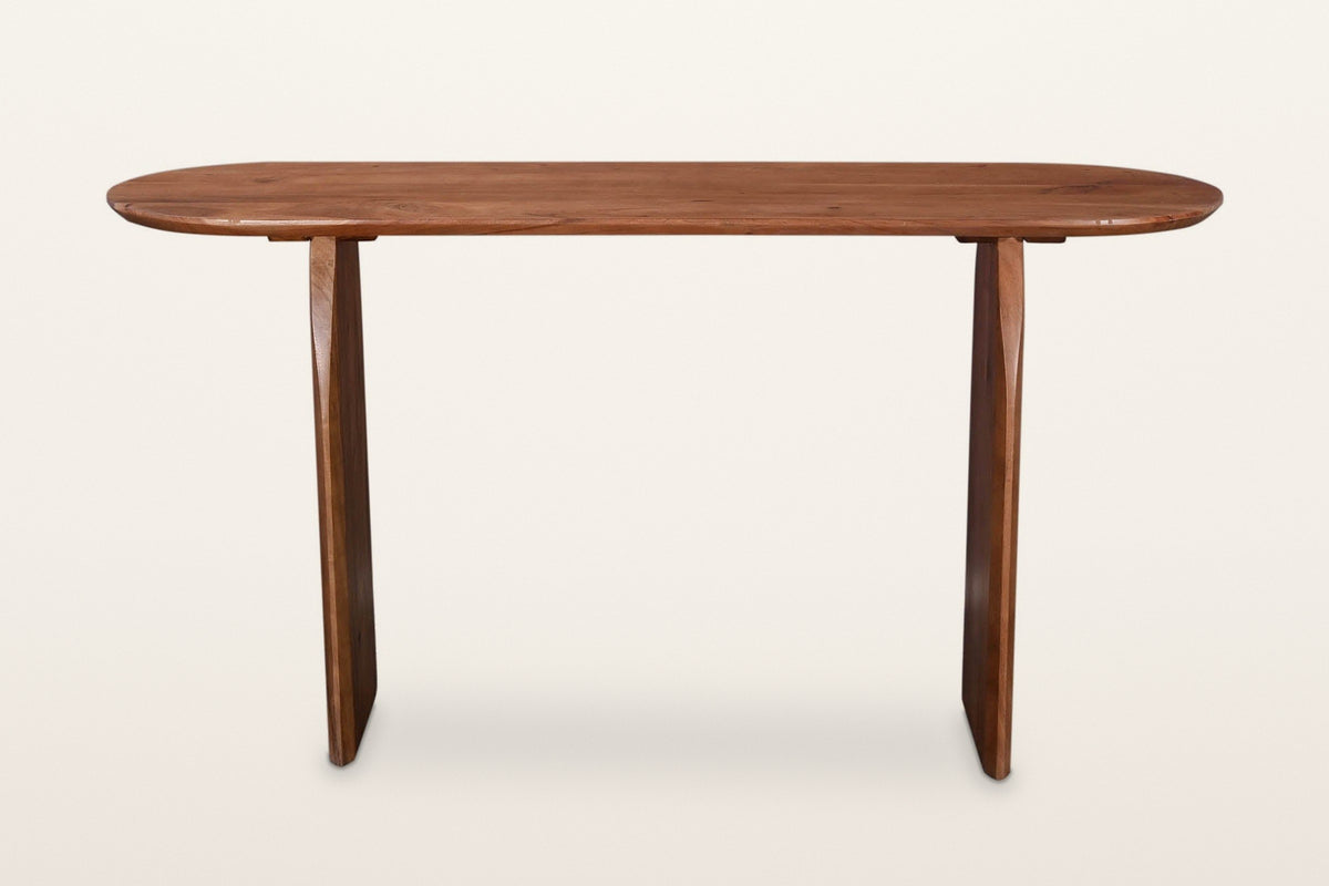 Visso console table in Pecan from the long side, on a warm white studio backdrop: the long top