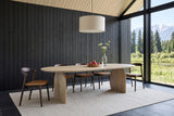 Visso dining table in Natural in a timber house in Golden, BC: charcoal board wall, glass to the Purcell Mountains