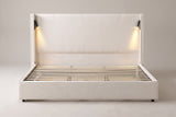 Viterbo shelter bed in beige, straight front view: tall flat headboard between two wings, a lit reading lamp inside each wing