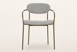 Vitorchiano arm dining chair from the front: the oval back pad, both bronze arms bending back to the hoop behind it, the seat pad and four straight legs