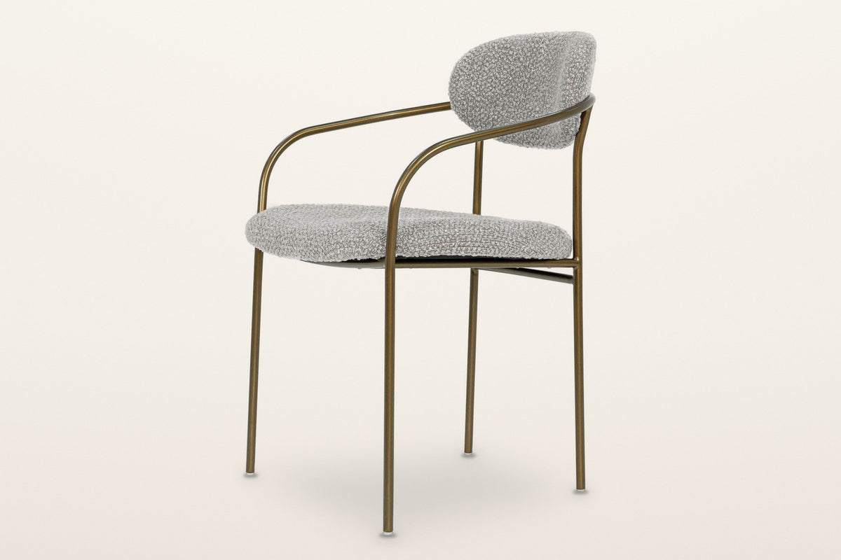 Vitorchiano arm dining chair from the other side: the arm curving back into the hoop, the side rail at seat height and the rear legs rising to the back pad