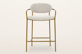 Vitorchiano counter stool from the front: the oval back pad between the two arms, the rounded seat, four straight legs and the footrest frame