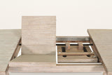 A Vitorchiano folding leaf opening out of the table, with the metal slides of the extension underneath