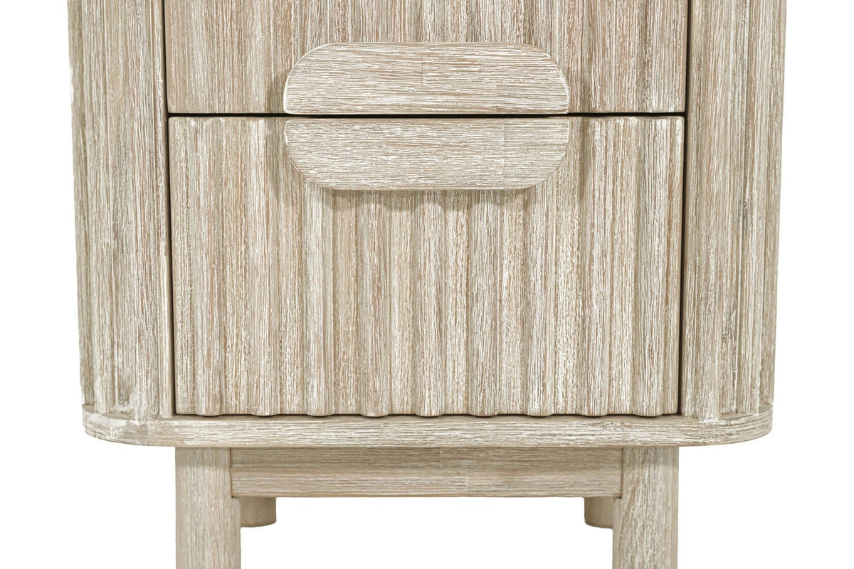 Close-up of the Vitorchiano drawer fronts: two wooden half-ovals meeting on the seam as one split oval pull