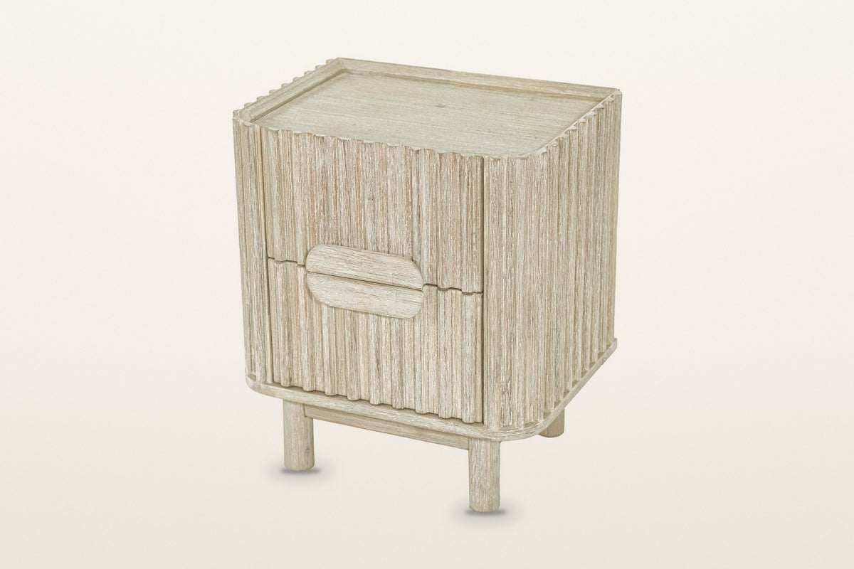 Vitorchiano nightstand in Natural White Wash seen from above on a warm white studio backdrop: the top inside its raised rim