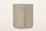 Vitorchiano side table in Natural White Washed from the front, on a warm white studio backdrop: the reeded drum