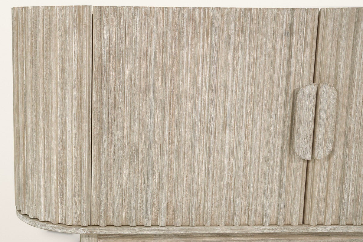 Close-up of the Vitorchiano reeds in Natural White Wash: the curved end, a front door and the split oval pull on the centre seam