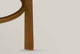 Close-up of the Vogogna round footring meeting a square Dark Walnut leg