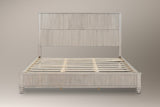 Volterra reeded bed in beige, straight front view of the bare frame and slats on a studio backdrop