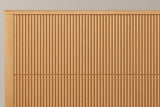 Close-up of the natural-finish Volterra headboard: the flat capped top rail