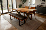 Wexford 70 in live edge table in a dining room with beamed ceiling