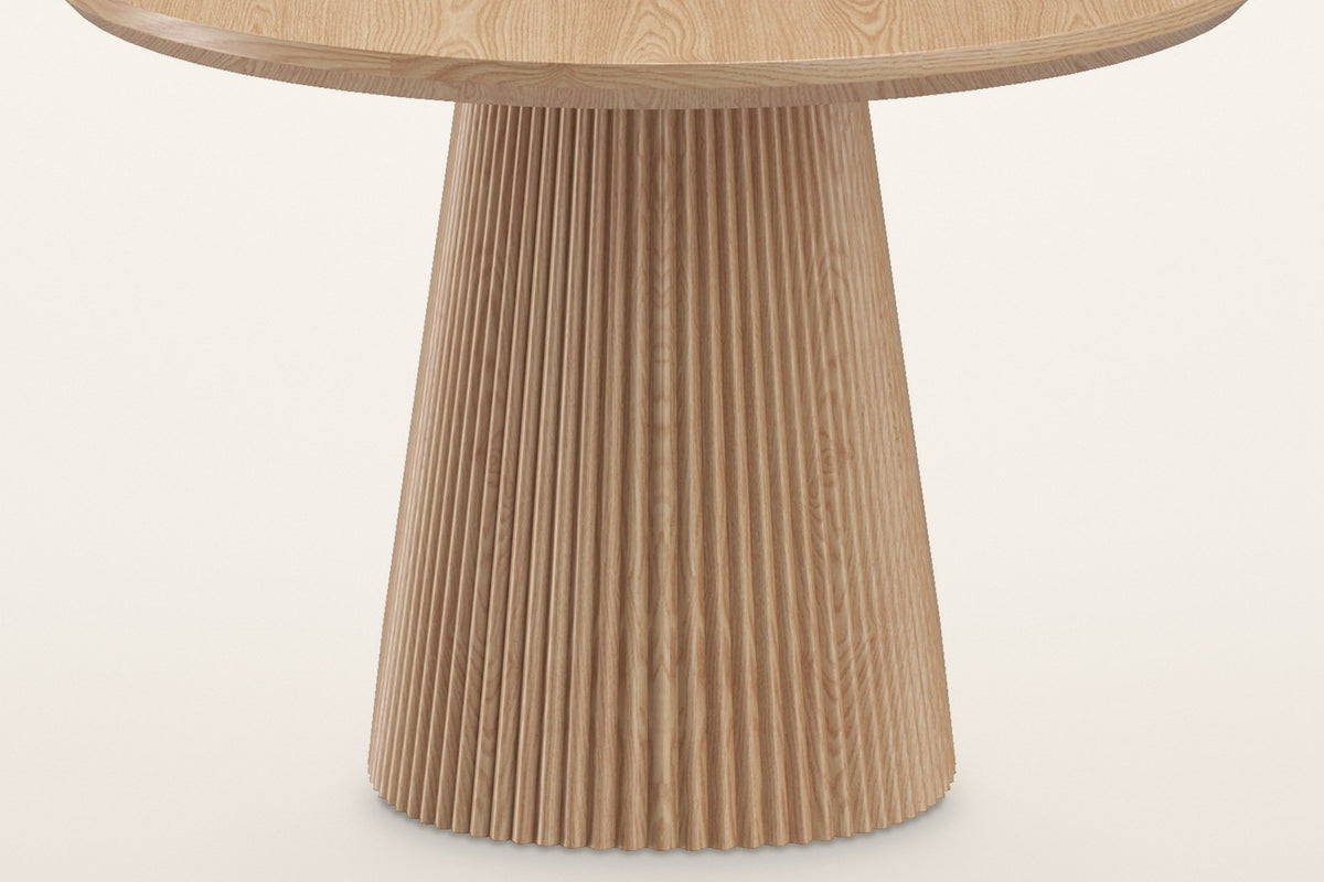 Close-up of the Yale pedestal in natural oak: fine vertical reeds under the bevelled top