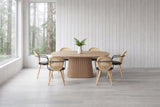 Yale 7-piece dining set in natural oak in a west-coast house near Tofino with whitewashed cedar walls and misty rainforest through the window