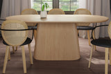 Yale natural oak veneer oval dining table with reeded pedestal in a bright dining room