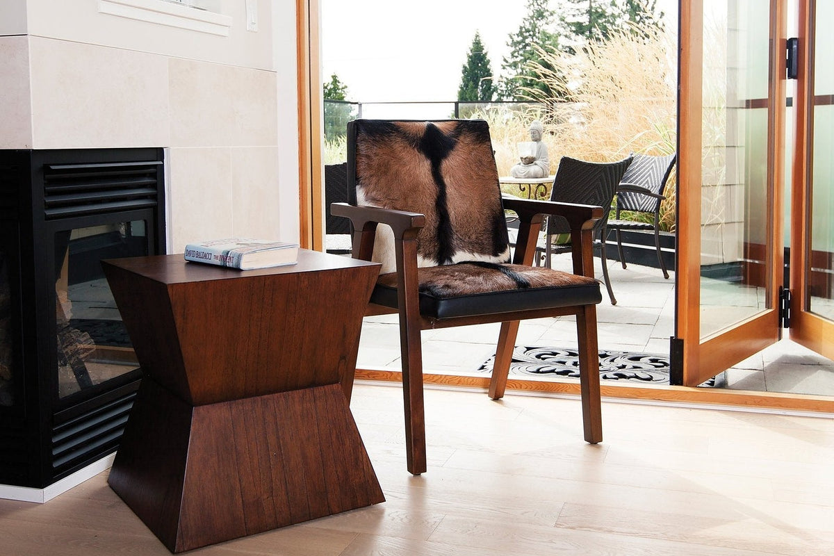 Yardley goat hide accent chair by open patio doors in a sunny living room