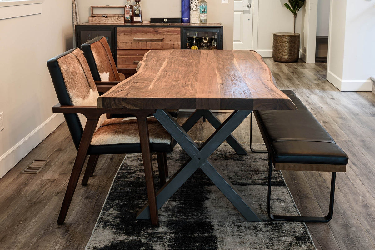 Yardley goat hide chairs at a live edge dining table