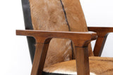Yardley chair close-up of the goat hide back, black trim and oak arm