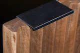 Black metal tab pull on a fluted mango wood door of the Zephyr sideboard