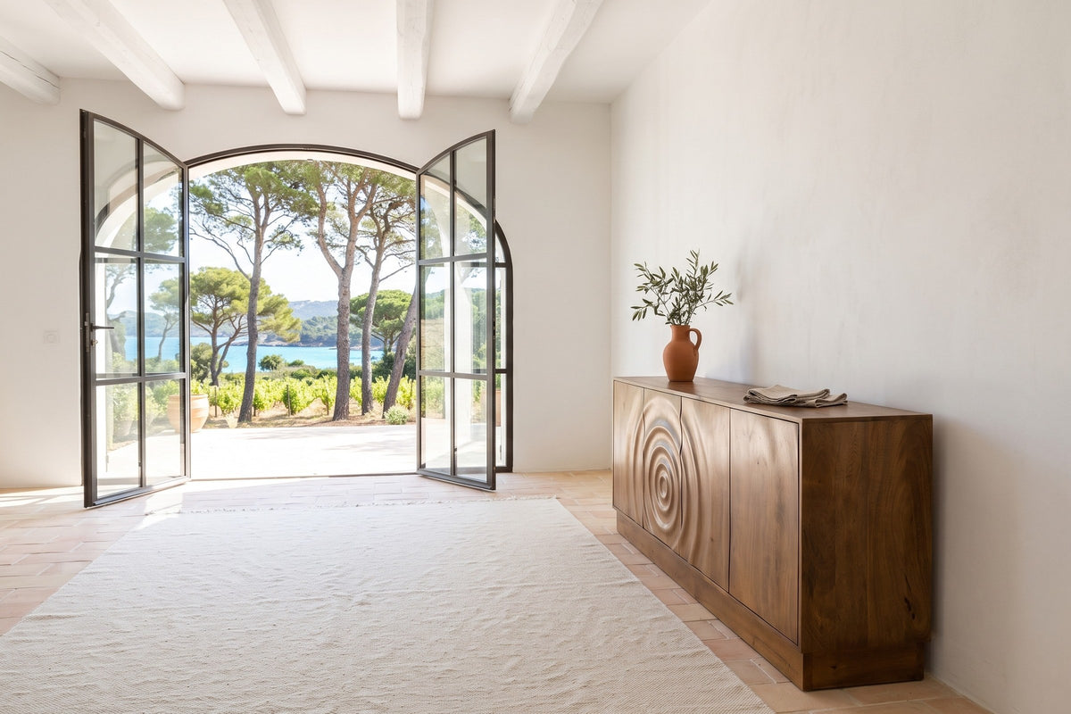 Zibello sideboard in Light Walnut seen from the end in a white plaster house on Porquerolles, with beams