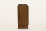The end of the Zibello sideboard in Light Walnut on a warm white studio backdrop: a plain mango end panel above the recessed