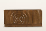Zibello sideboard in Light Walnut, straight front view on a warm white studio backdrop: four handle-less doors with carved ri