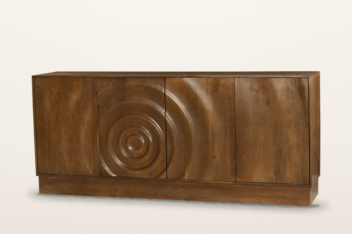 Zibello carved mango wood sideboard in Light Walnut on a warm white studio backdrop: four plain doors